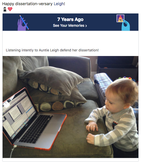 Picture of young child intently looking at a laptop screen.  